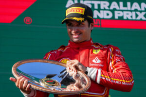 Carlos Sainz of Spain celebrates on the podium after winning the Australian Formula One Grand Prix at Albert Park, in Melbourne, Australia, Sunday, March 24, 2024. (AP Photo / Asanka Brendon Ratnayake)