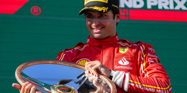 Carlos Sainz of Spain celebrates on the podium after winning the Australian Formula One Grand Prix at Albert Park, in Melbourne, Australia, Sunday, March 24, 2024. (AP Photo / Asanka Brendon Ratnayake)